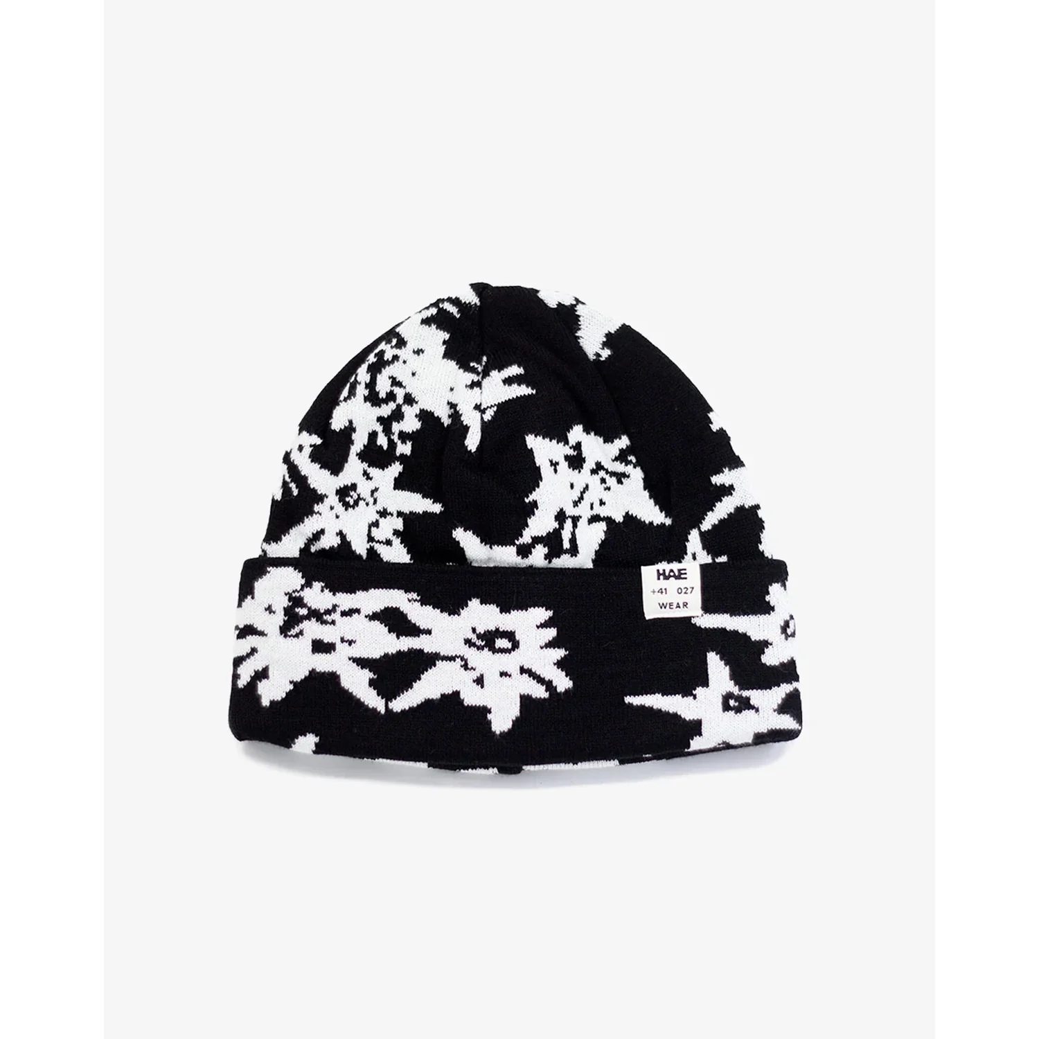 Bonnet en tricot, noir et blanc, motif floral, bord rabattu