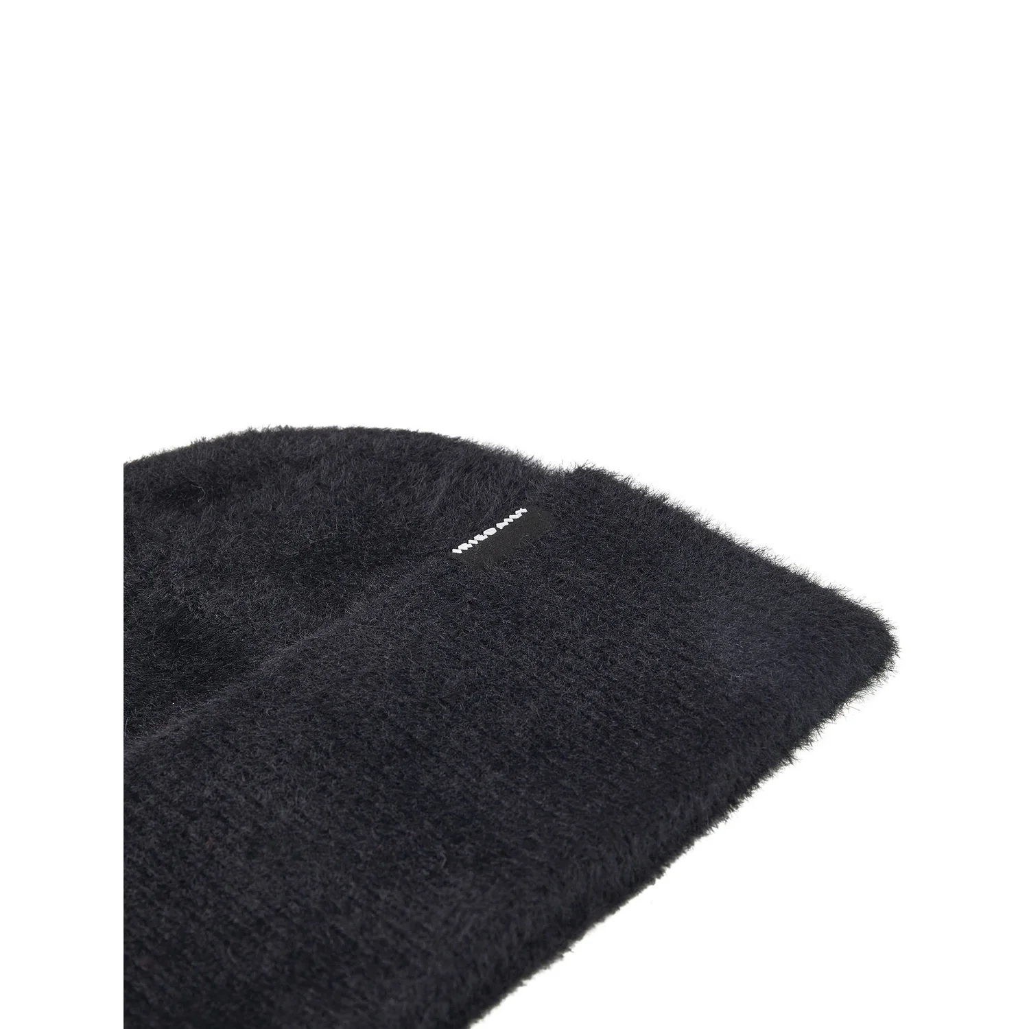 Tapis noir, à poils longs, surface moelleuse