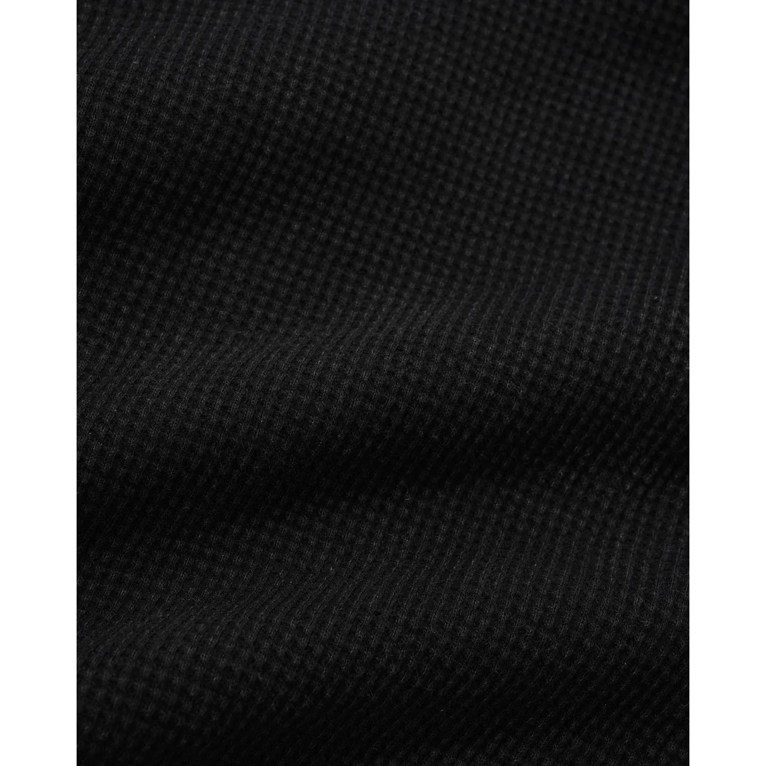 Tissu noir, structure gaufrée, tissu textile