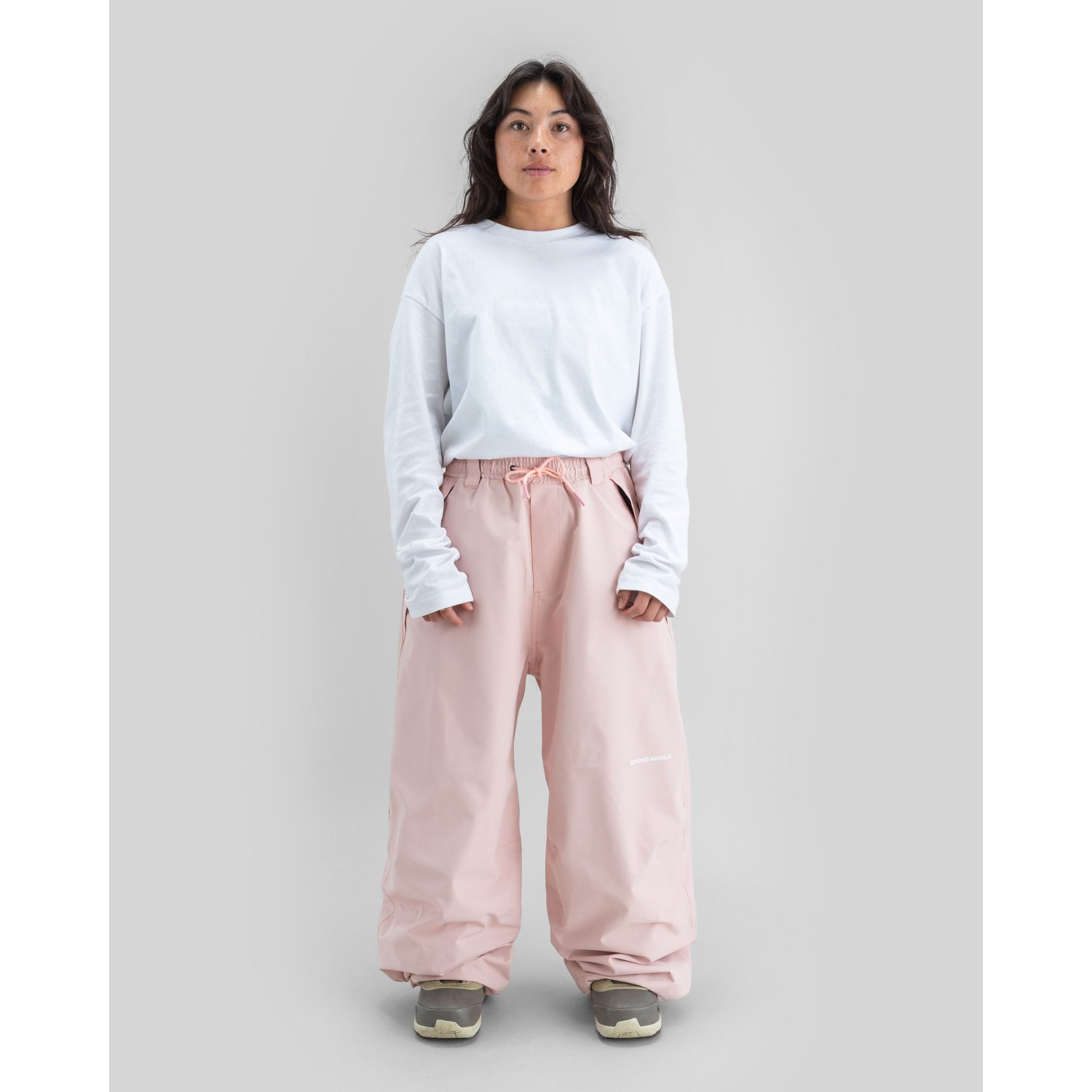 snowboard pants, pink pants, baggy pants, drawstring waist, neutral top