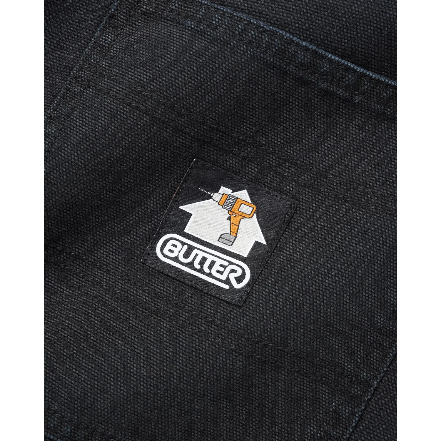 Work Pants Arbeitskleidung, schwarzer Stoff, gewebtes Muster, Logoaufnäher, Werkzeugmotiv
