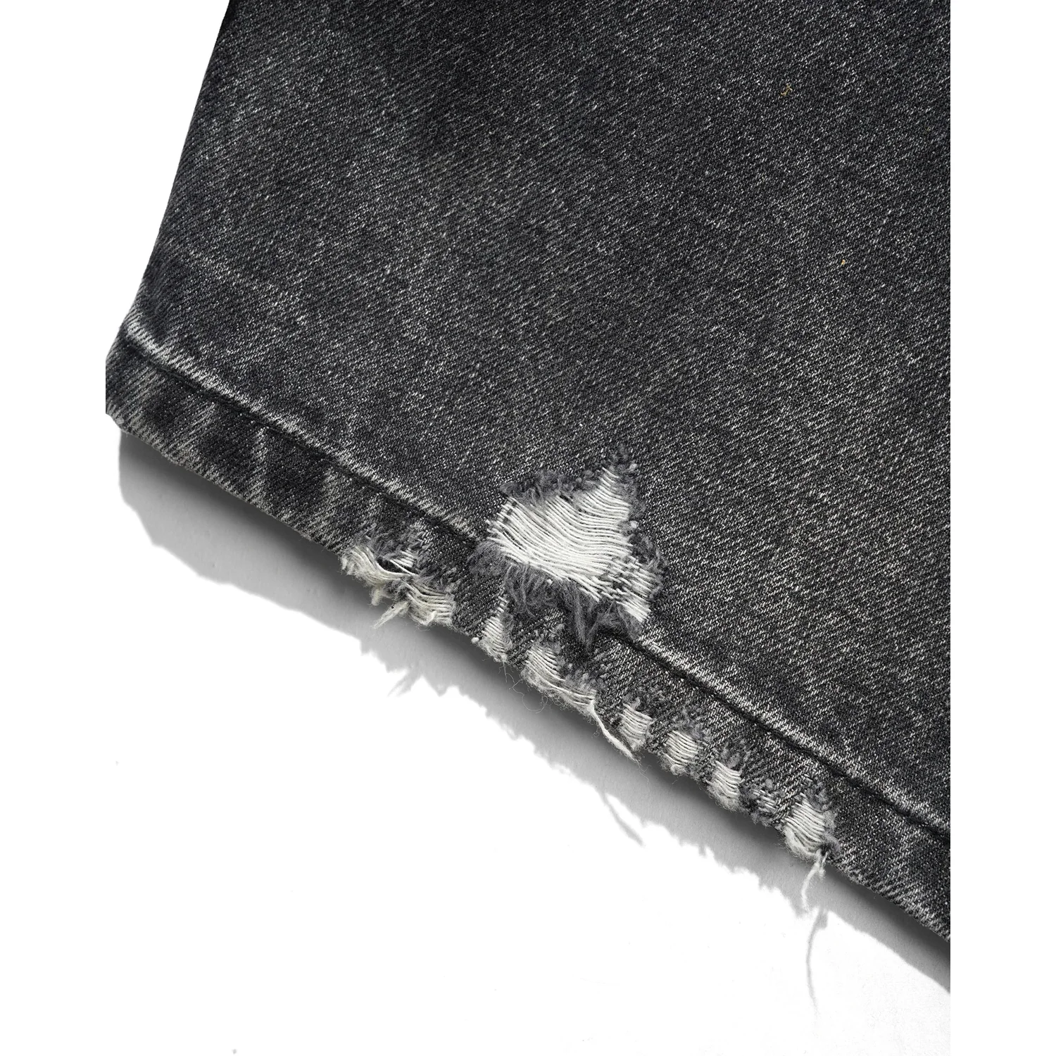 Tissu denim, gris-noir, ourlet déchiré, bord effiloché
