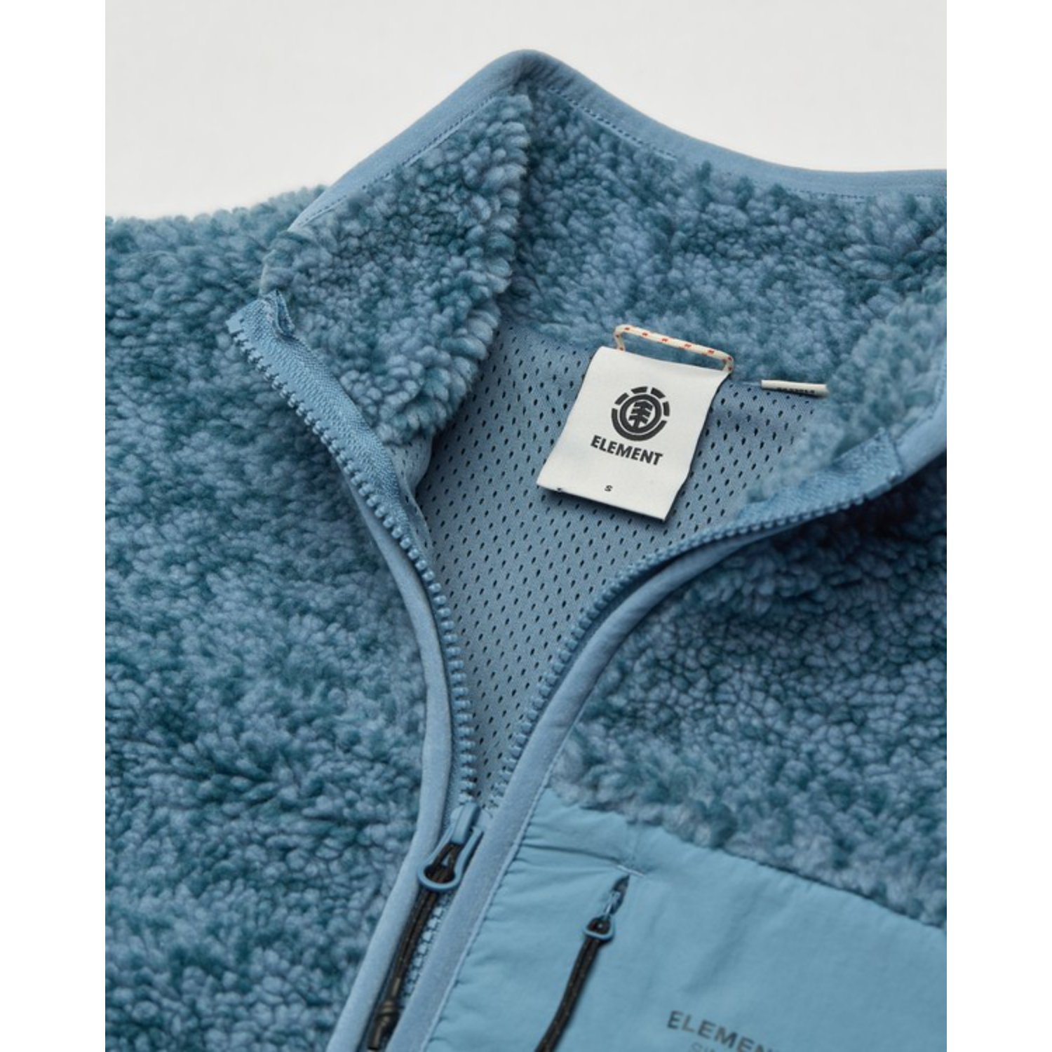 Manteau en polaire, veste en polaire, bleu, fermeture éclair, étiquette de marque