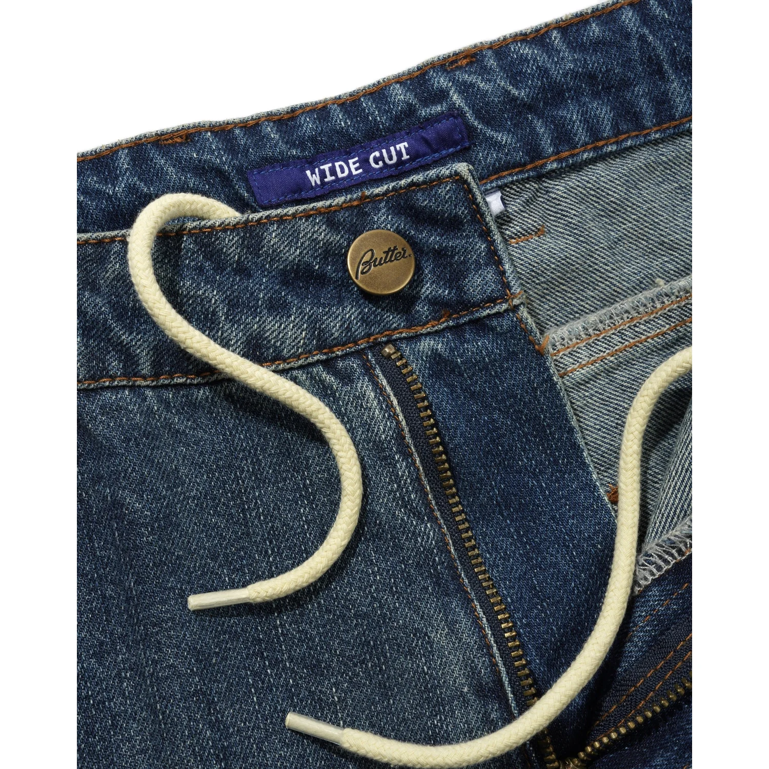 Jean, coupe ample, denim bleu, cordon de serrage, fermeture éclair